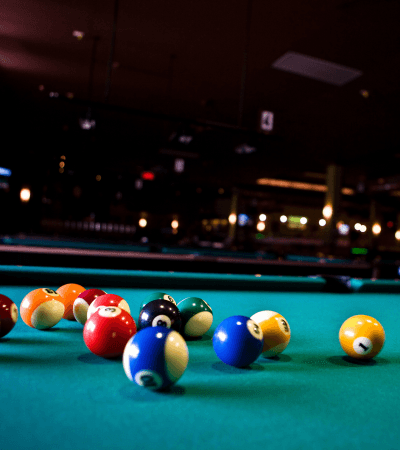 Pool table with colorful balls spread out